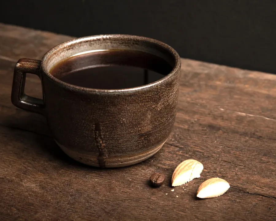 Colombia Huila, a finished Rhine Coffee drink photographed on a dark wooden table