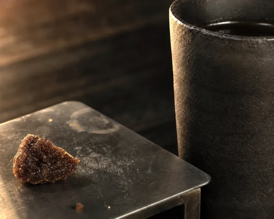 Guatemala Antigua, a finished Rhine Coffee drink photographed on a dark wooden table